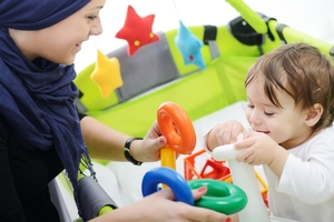 Parent playing with toys