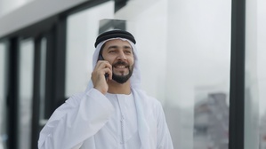Middle East man holding mobile