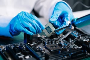 The technician repairing the motherboard in the lab with copy space-1
