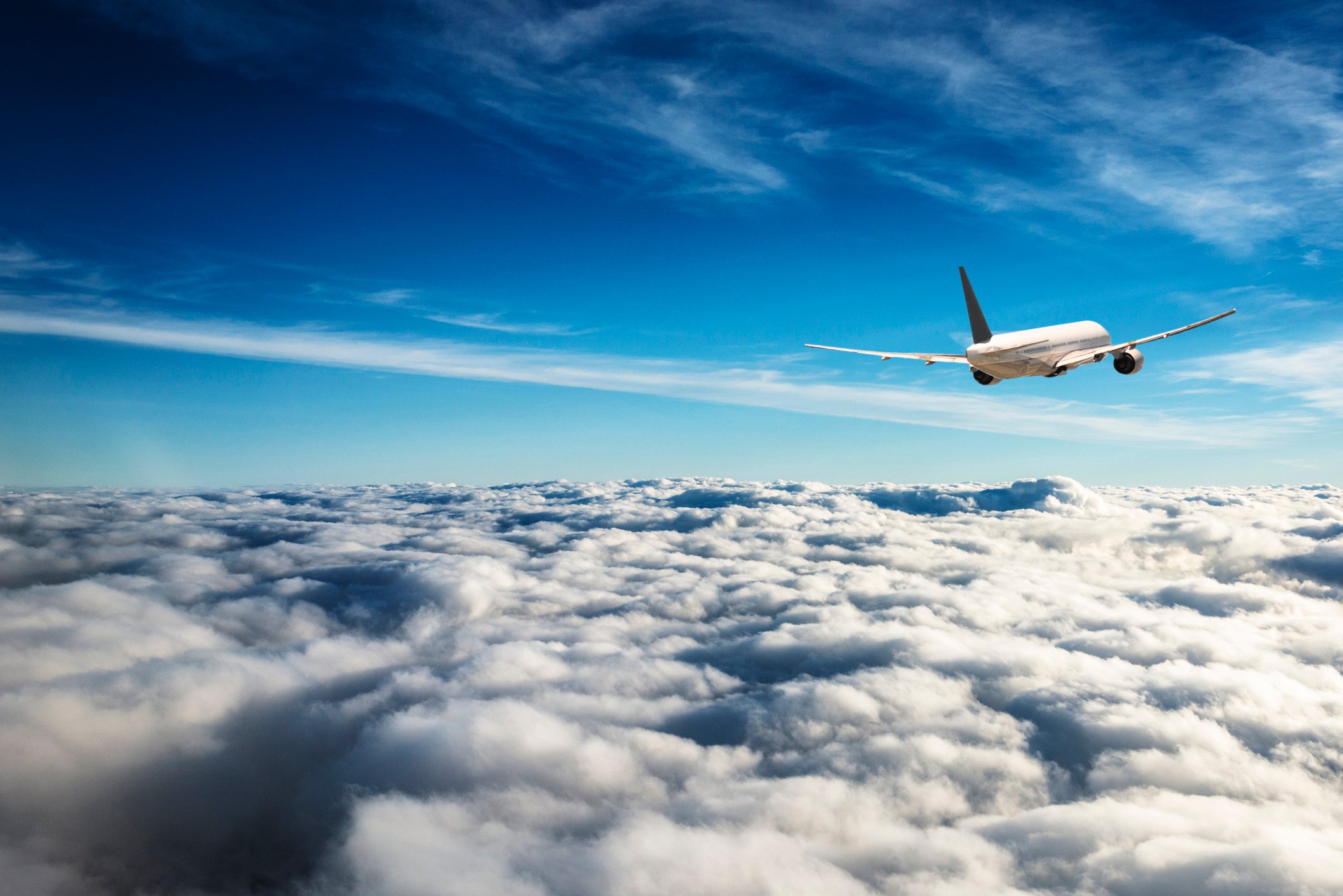 Airplane flies above the skies