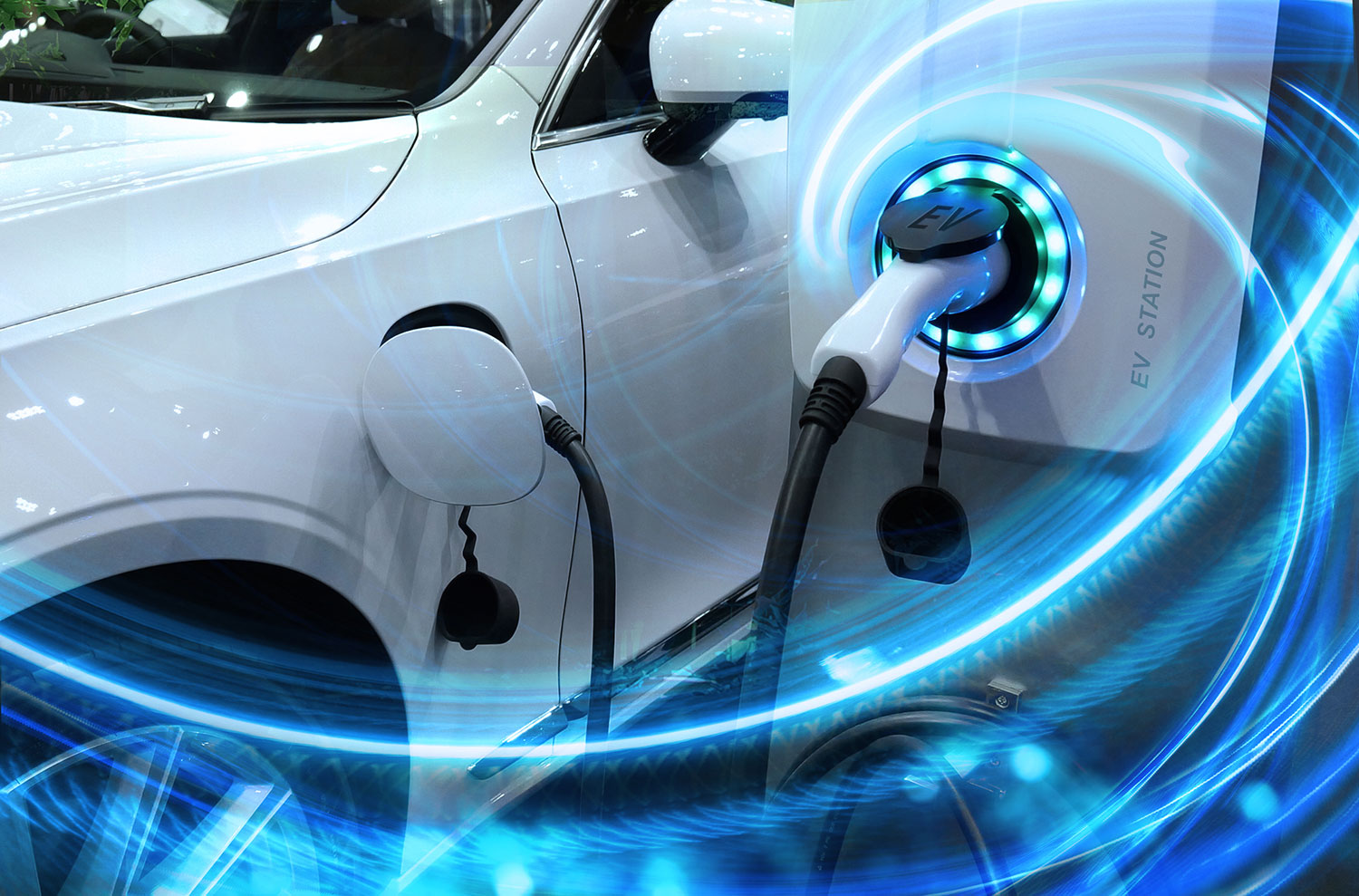 EV_Car_or_Electric_vehicle_at_charging_station_with_the_power_cable_supply_plugged_in_on_blurred_nature_with_blue_enegy_power_effect.